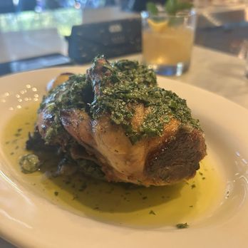 Mothers and Sons Trattoria - Hearth-roasted chicken,Charred escarole,Salsa verde - Italian Near Me - Durham, North Carolina