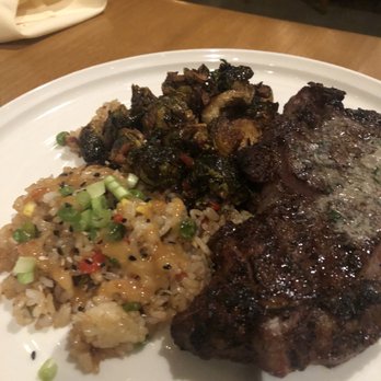The Lime Lite - The Woodfire Ribeye with Bacon Fried Rice and Brussel Sprouts it was $39 but 9/10 soooo delicious!!! 01/29/22 - New American Near Me - Fresno, California