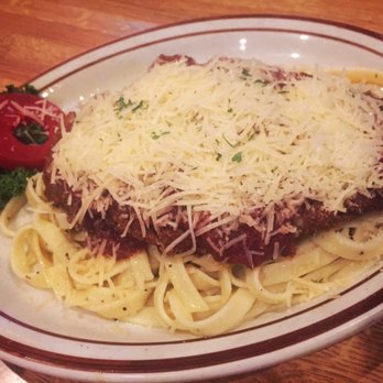 Stockton's Restaurant & Spirits - Giant Chicken Parmesan over fettuccini noodles- yum! Fancy poached pear slices on the side! So good! - Bars Near Me - Maple Valley, Washington