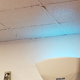 Dirty, dusty ceiling with a nice fly zapper on wall. Didn't work well because flies were everywhere. Dirty, dusty ceiling with a nice fly zapper on wall. Didn't work well because flies were everywhere.
