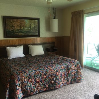 Boulder Lodge - Our room. Plus a fridge and microwave.  Table and chairs.  Lounge chairs on balcony. - Hotels Near Me - June Lake, California
