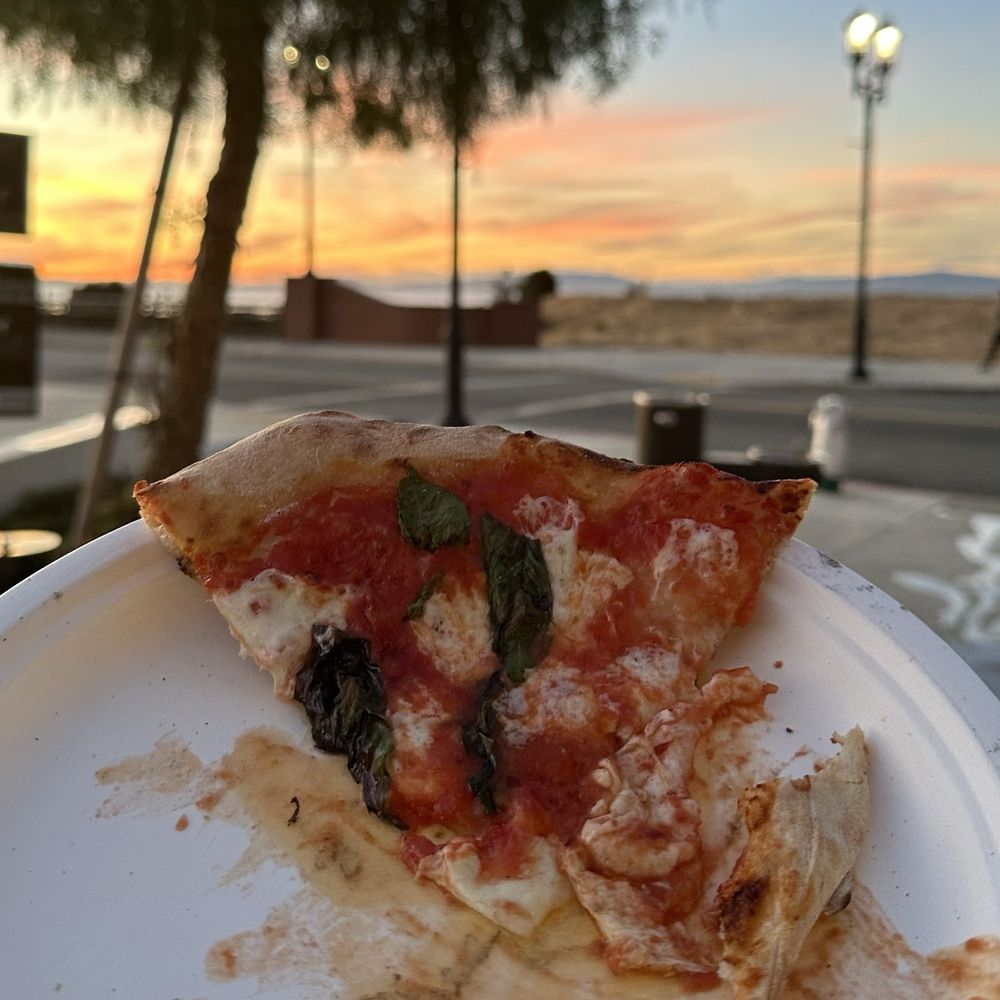 Only slice left of a margarita pizza