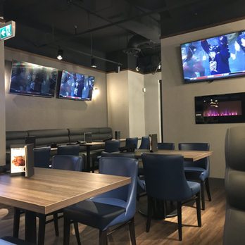 The Wave Bar & Lounge - More "private" area of the restaurant, closer to the main door. The other side (not pictured) has a huge bar and tons of seating. - Sports Bars Near Me - Mississauga, Ontario The Wave Bar & Lounge - More "private" area of the restaurant, closer to the main door. The other side (not pictured) has a huge bar and tons of seating. - Sports Bars Near Me - Mississauga, Ontario