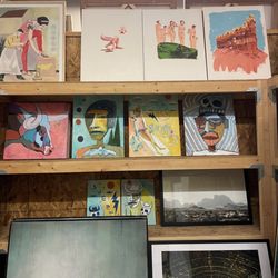 Commerce Gallery - Pieces of art in back.