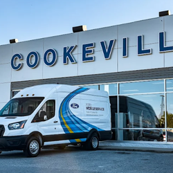 Ford of Cookeville - Ford of Vookeville storefront with Mobile Service Van parked in front.