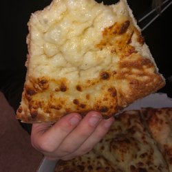Vocelli Pizza - That is the cheese peeled back on the pizza so there's your proof