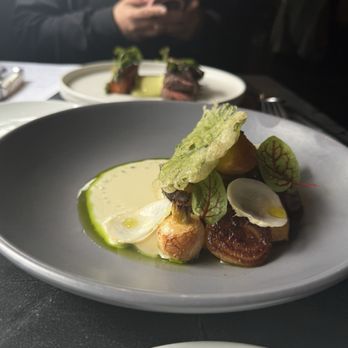 Crawford & Son - Roasted monkfish so good! With roasted turnips, lardo, and a tempura leaf. - New American Near Me - Raleigh, North Carolina