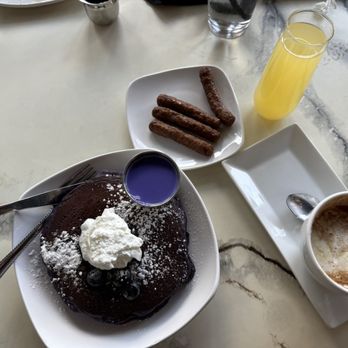 Easy Like Sunday - Ube pancakes, chicken sausage links, mimosa, brown sugar chantilly latte. - Breakfast & Brunch Near Me - Charlotte, North Carolina Easy Like Sunday - Ube pancakes, chicken sausage links, mimosa, brown sugar chantilly latte. - Breakfast & Brunch Near Me - Charlotte, North Carolina