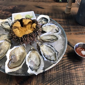 Seattle Fish Guys - Oysters in a half shell and uni - Seafood Markets Near Me - Seattle, Washington Seattle Fish Guys - Oysters in a half shell and uni - Seafood Markets Near Me - Seattle, Washington