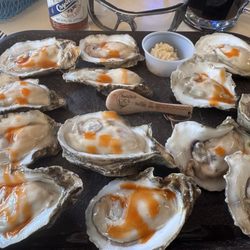 Ouzts Too - Dozen raw oysters with some hot sauce sprinkled over the top. Notice my mini BaddBob Wooden Spoon in the middle.