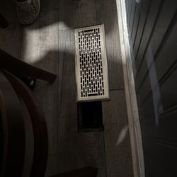Mexico Restaurant - The vent is not secure, leaving room for your chair to fall through a HOLE in the floor!