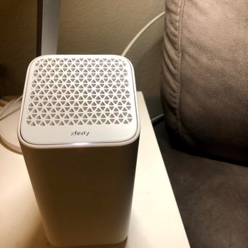 Xfinity Store by Comcast - The modem/router is pretty sleek looking! This little light is on all the time to indicate a working connection - Internet Service Providers Near Me - Oakland, California
