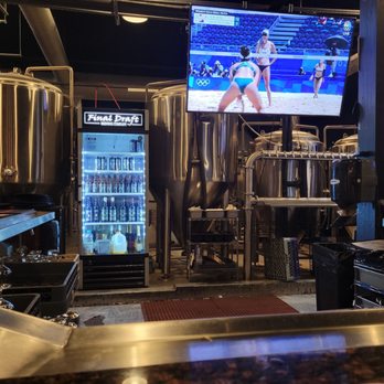 Final Draft Brewing Company - Tv over the bar and a fridge with some special bottles - Breweries Near Me - Redding, California