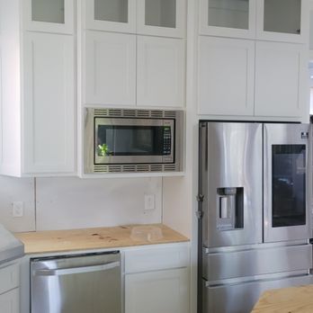 Yeager Properties - a kitchen with stainless steel appliances - General Contractors Near Me