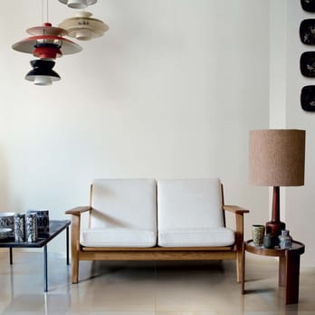Floors & Tiles - a living room with a white couch and a coffee table - Flooring Near Me - Kissimmee, Florida Floors & Tiles - a living room with a white couch and a coffee table - Flooring Near Me - Kissimmee, Florida