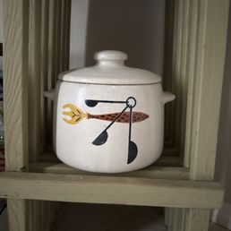 Vintage pot that I used to store my bird food that I keep by the front door. Vintage pot that I used to store my bird food that I keep by the front door.