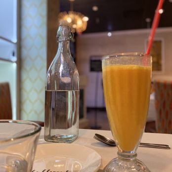 Bay Leaf Indian Kitchen - Mango lassi and cold water brought to the table. - Indian Near Me - Fresno, California