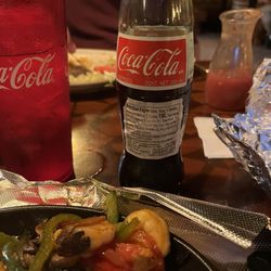 El Vaquero Mexican Restaurant - Mexican coke and shrimp fajitas with corn tortillas.