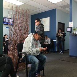 Butchart Health Center - Every chair is full and people are standing waiting, a lot of waiting