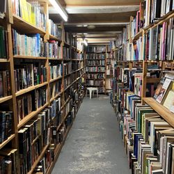 The Book Exchange - Sci-fi and fantasy on the left and back
