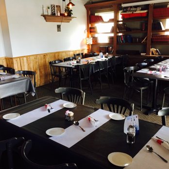 Express du Sud - a dining room with tables and chairs - Cafes Near Me - Charny, Quebec Express du Sud - a dining room with tables and chairs - Cafes Near Me - Charny, Quebec