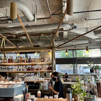 40 LBS Coffee + Bar - a man working in a coffee shop - Coffee & Tea Near Me - Portland, Oregon