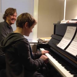East Side Piano Lessons - Mr. John and Student at piano
