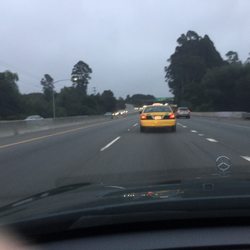 Yellow Cab Co Of Santa Cruz - Yellow Cab taxi #165 driving south on Hwy 1, over 80 mph, recklessly weaving thru traffic, and making obscene gestures at these cars.