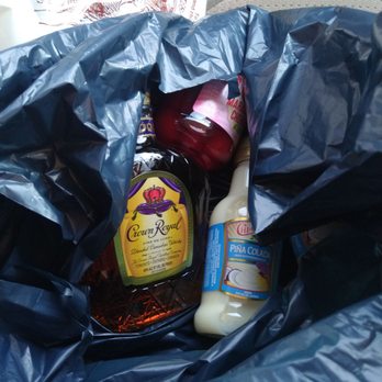 Virginia ABC - a bottle of honey and a bottle of ketchup in a blue bag - Beer, Wine & Spirits Near Me - Virginia Beach, Virginia