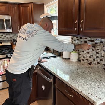Chicagoland Home Inspectors - AJ inspecting the kitchen - Home Inspectors Near Me - Northbrook, Illinois