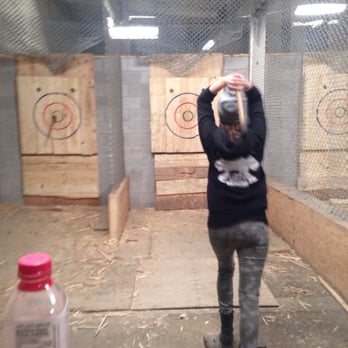 BATL Axe Throwing - League member throwing her axe wearing her BATL swag - Axe Throwing Near Me - Toronto, Ontario BATL Axe Throwing - League member throwing her axe wearing her BATL swag - Axe Throwing Near Me - Toronto, Ontario