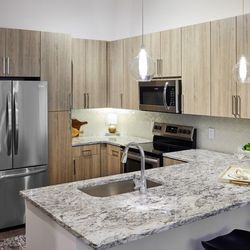 Passport Apartments Herndon - Modern kitchen with sleek finishes