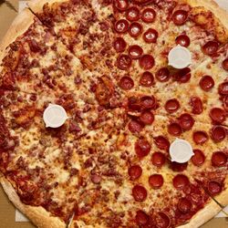 Pino's Pizza - $31 | 20" Pizza w/ half bacon & half pepperoni. Additional toppings for a 20" is $6 per topping. Total = $37 before taxes.