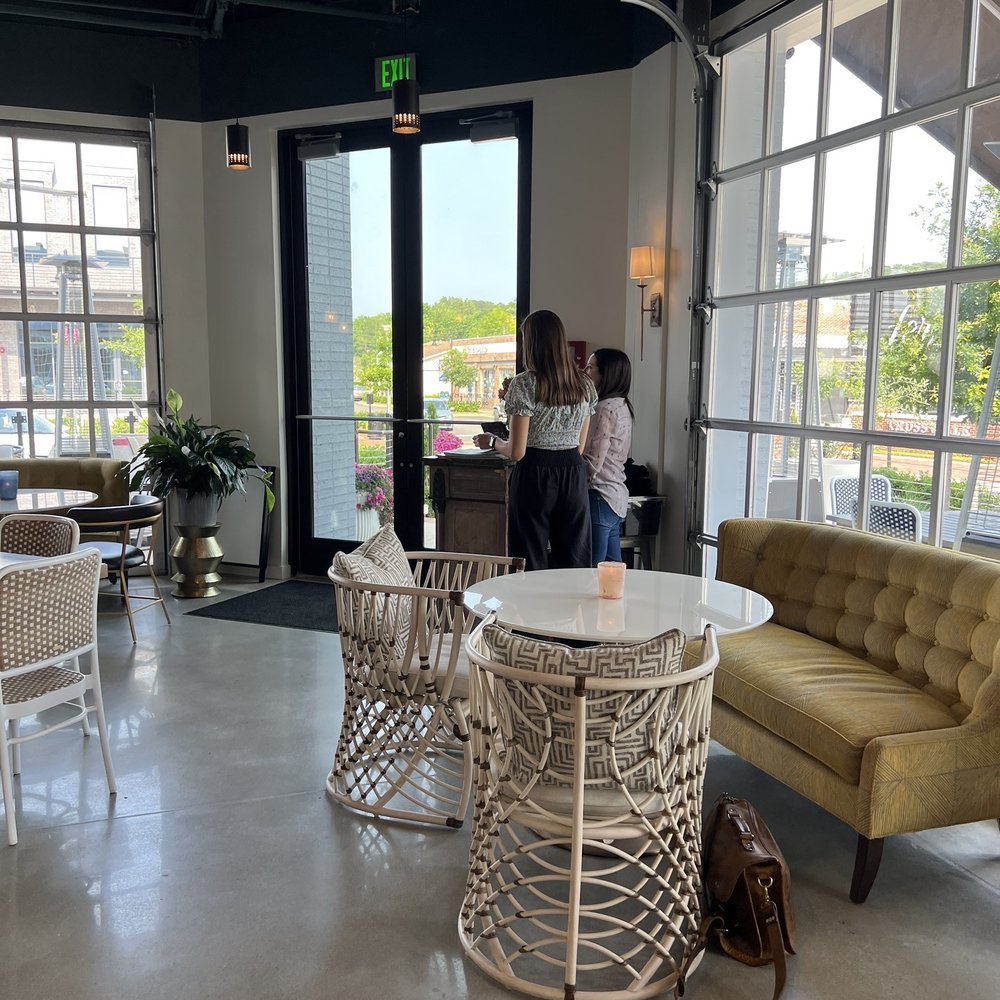 Corbeau Wine Bar - two women standing at a table - Wine Bars Near Me - Trussville, Alabama Corbeau Wine Bar - two women standing at a table - Wine Bars Near Me - Trussville, Alabama