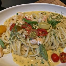 Lobster Spaghetti (spaghetti with Atlantic lobster, prawns, cherry tomatoes, Italian parsley, white wine, shallots, and lobster-lemon butter