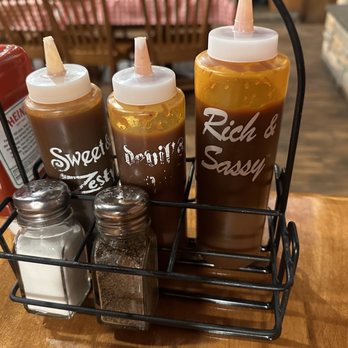 Famous Dave's Bar-B-Que - ows a rack of condiments - Barbeque Near Me - Tualatin, Oregon