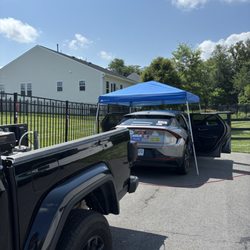 Nur’s Pressure Washing - Professional Exterior Detail Setup. Hot weather? No problem! We will come with a canopy to protect your paint from the heat.