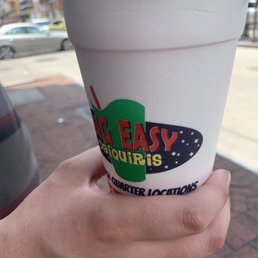 a hand holding a cup a hand holding a cup