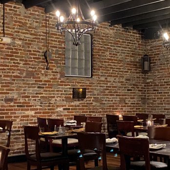 Mare E Monti - a dining room with a brick wall - Italian Near Me - Worcester, Massachusetts Mare E Monti - a dining room with a brick wall - Italian Near Me - Worcester, Massachusetts