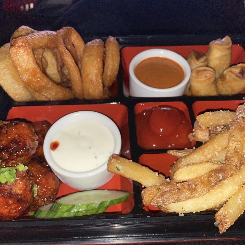 Appetizer Bento box: onion rings, Thai chicken, Philly rolls and fries Appetizer Bento box: onion rings, Thai chicken, Philly rolls and fries