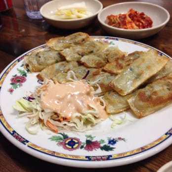 Mdk Noodles - Fried dumplings w/bowls of veggies and Kim Chee in background. These were super tasty & reminded me of the best Japanese gyoza - Korean Near Me - Anaheim, California Mdk Noodles - Fried dumplings w/bowls of veggies and Kim Chee in background. These were super tasty & reminded me of the best Japanese gyoza - Korean Near Me - Anaheim, California
