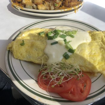 Louie's Cafe - Seafood omelet. Shrimp and crawfish - Breakfast & Brunch Near Me - Baton Rouge, Louisiana Louie's Cafe - Seafood omelet. Shrimp and crawfish - Breakfast & Brunch Near Me - Baton Rouge, Louisiana