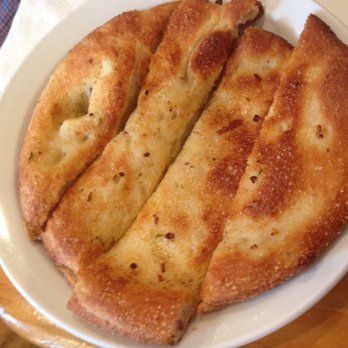 Grog's Pub & Grill - Garlic toast that comes with chicken penne pasta - Pubs Near Me - Thedford, Ontario Grog's Pub & Grill - Garlic toast that comes with chicken penne pasta - Pubs Near Me - Thedford, Ontario