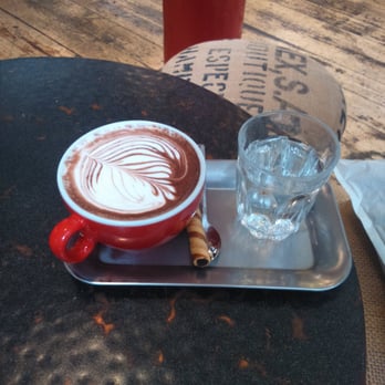 Pot Kettle Black - Hot chocolate, water and biscuit both nice touches - Coffee & Tea Near Me - Manchester, XGM