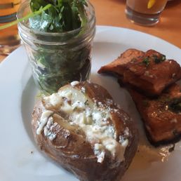 Crispy trout with baked potato and a 3 cheese bacon butter with farmhouse salad Crispy trout with baked potato and a 3 cheese bacon butter with farmhouse salad
