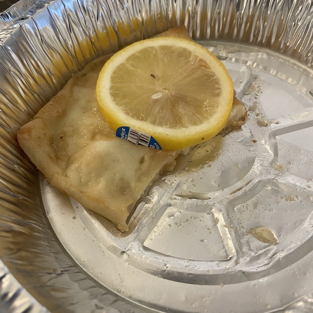 a slice of lemon on a plate a slice of lemon on a plate