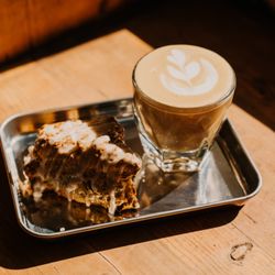 Cabra Coffee - Cortado with single origin espresso and a scratch-made scone.