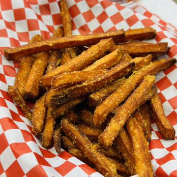 Crimson Crab - a basket of fries on a table - Seafood Near Me - Houston, Texas Crimson Crab - a basket of fries on a table - Seafood Near Me - Houston, Texas