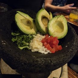 Guacamole, smashed right at the table!