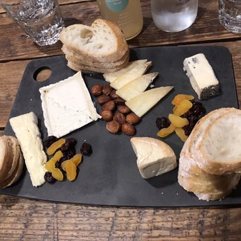 Scardello - Triple creme brie, truffled goat, mild truffle cheddar, caveman blue, and a washed rind. - Cheese Shops Near Me - Dallas, Texas Scardello - Triple creme brie, truffled goat, mild truffle cheddar, caveman blue, and a washed rind. - Cheese Shops Near Me - Dallas, Texas